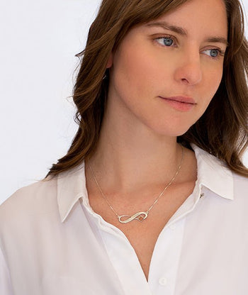 שרשרת כסף תליון אינפיניטי עם ננו תנ"ך - תיק התיקיםJNB Jewishחנות "ג'רוזלם ננו תנ"ך" היחיד שמיוצר בישראל